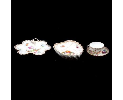 Four items of Dresden porcelain including a lobed entree dish, 21cm, a leaf-shaped dish, 19cm (damaged); and a cup and saucer