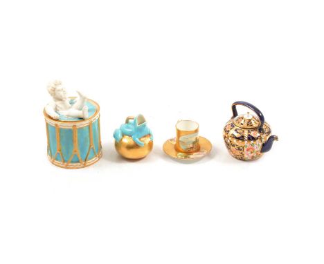 Royal Crown Derby miniature kettle, decorated in Imari colours, 7cm, a Worcester jar modelled as a boy in a drum, a Copeland 