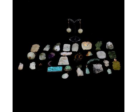 Collection of carved Chinese stone pendants, jewellery, and similar, including a white metal mounded clip with carved jade fl