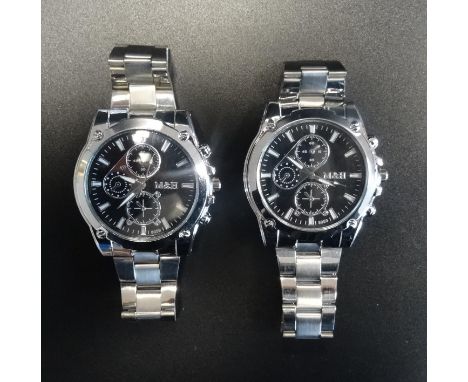 EIGHT NEW M & H GENTLEMAN'S WRISTWATCHESthe circular black dial on each with hour baton markers, sweep second hand and three 