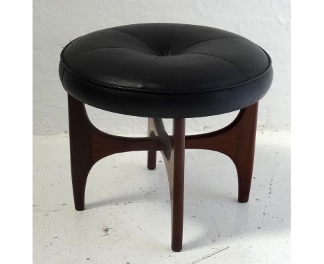 LEATHER G PLAN "ASTRO" STOOLof circular shape with single central button in upholstery, standing on shaped teak supports, 50c