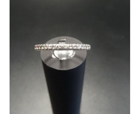 DIAMOND SET HALF ETERNITY RINGon eighteen carat white gold shank, ring size L 