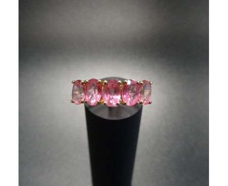 PINK SAPPHIRE FIVE STONE RINGthe five oval cut sapphires on nine carat gold shank with split shoulders, ring size P 