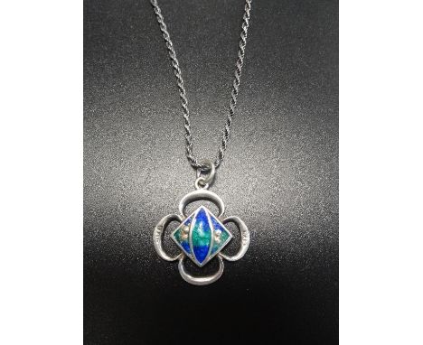 ENAMEL DECORATED SILVER PENDANTof quatrefoil design, on silver chain 