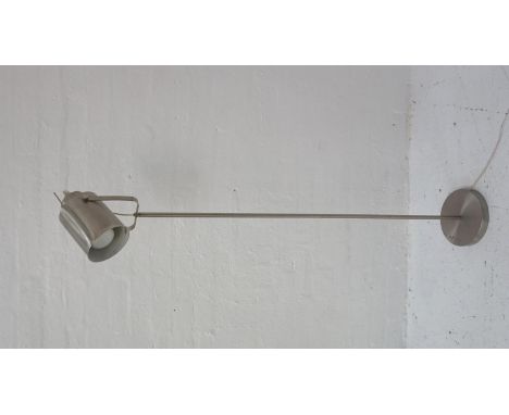 BRUSHED STEEL STANDARD LAMPraised on a circular base and column with an adjustable search light style lamp, 150cm high 