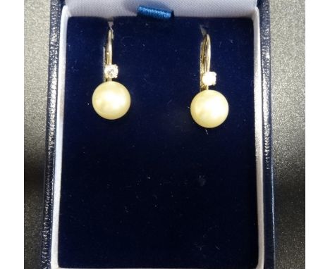PAIR OF DIAMOND AND SIMULATED PEARL EARRINGSin fourteen carat gold 