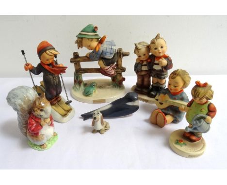SMALL COLLECTION OF CERAMIC FIGUREScomprising Goebel/Hummel Skier; Max & Moritz, Retreat to Safety, Joyful and Little Gardner