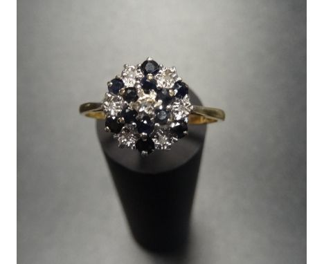 SAPPHIRE AND DIAMOND CLUSTER RINGon nine carat gold shank with stepped setting, ring size R-S 