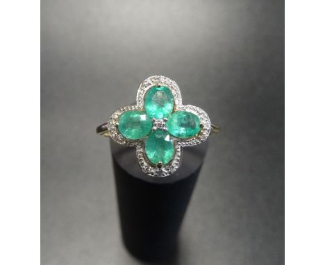 EMERALD AND DIAMOND CLUSTER RINGthe four oval cut emeralds in diamond set quatrefoil surround, on nine carat gold shank, ring