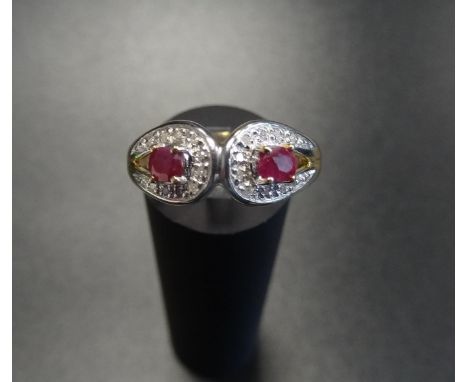 RUBY AND DIAMOND CLUSTER RINGeach of the two rubies in diamond surround, on nine carat gold shank, ring size P 