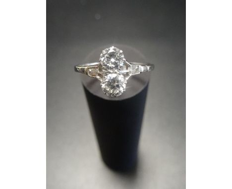 DIAMOND TWO STONE RINGthe diamonds in unusual vertical setting totalling approximately 0.6cts, on platinum shank with small b