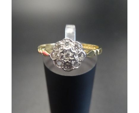 DIAMOND CLUSTER RINGthe central diamond in eight diamond surround, in all approximately 0.25cts, on eighteen carat gold shank