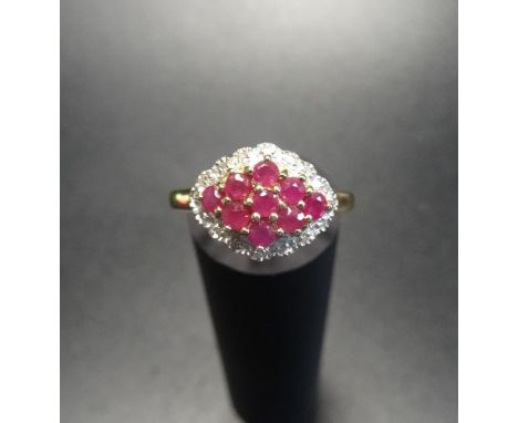 RUBY AND DIAMOND CLUSTER RINGthe multi rubies in illusion set diamond surround, on nine carat gold shank, ring size N 