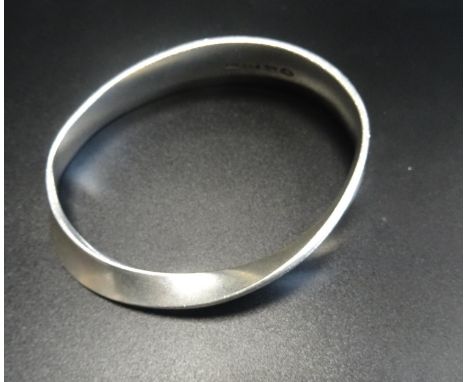 GEORG JENSEN SILVER MOBIUS BANGLE to a design by Vivianna Torun, the bangle of twist design, stamped 206, Georg Jensen in dot