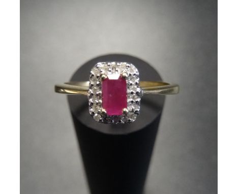 RUBY AND DIAMOND CLUSTER RINGthe central ruby in diamond surround, on nine carat gold shank, ring size M-N 