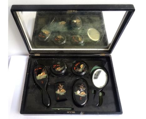 CHINESE EXPORT WARE TRAVELLING DRESSING TABLE SETcontained in an ebonised box decorated with animals in front of a house and 