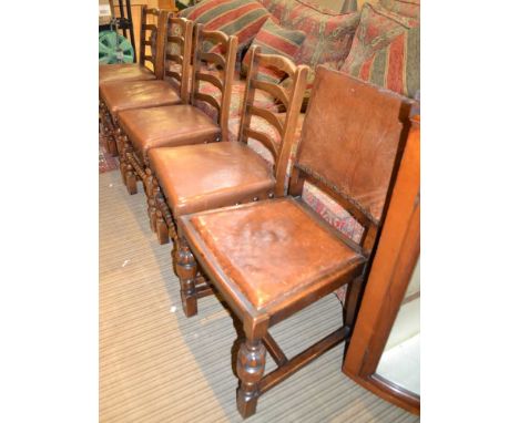 A set of five single ladder back dining chairs, with studded seats
