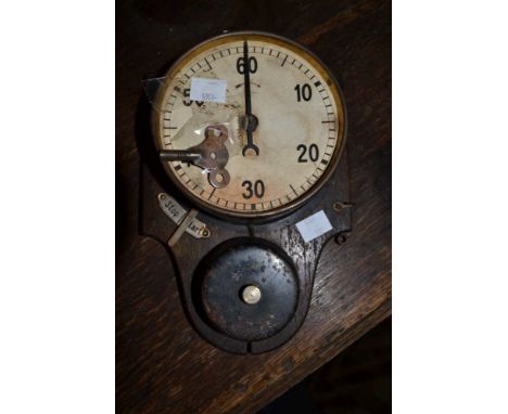 A vintage wall mounted clockwork stop-clock