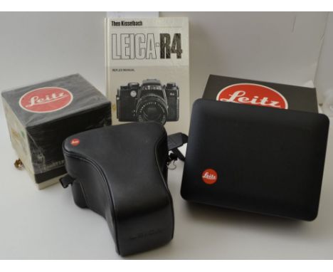 A "Leica" R5 35mm SLR camera body, fitted with a "Leitz" Vario-Elmar-R 35-70 lens, in leather case with shoulder strap, toget