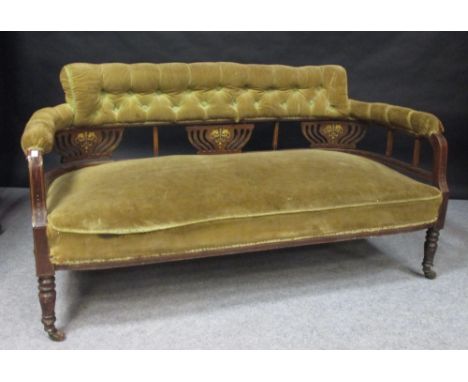 A late Victorian button upholstered settee, 140cm wide x 59cm wide x 74cm high  Overall quite tired and tatty. Needs re-uphol