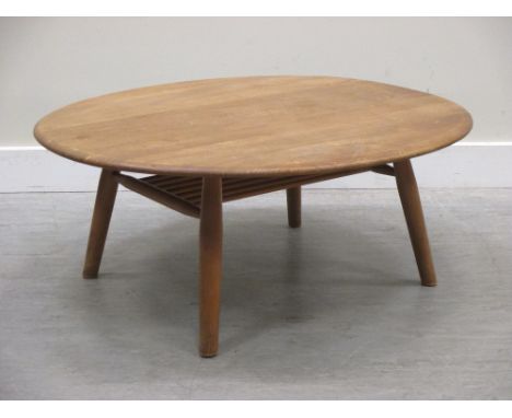 An Ercol light elm coffee table, 100cm diameter  