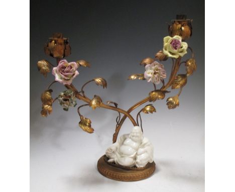 A blanc de Chine Budai mounted two ormolu light candelabrum  