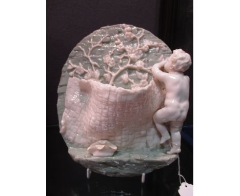 A pair of Worcester wall pockets with cherubs picking plums in a net, 22cm high (2)  