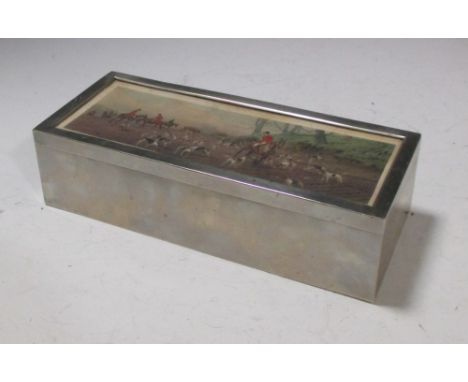 A white metal box inset with a watercoloured fox hunting scene  