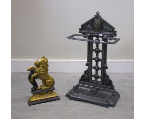 A Victorian style cast iron stick stand and painted lion doorstop