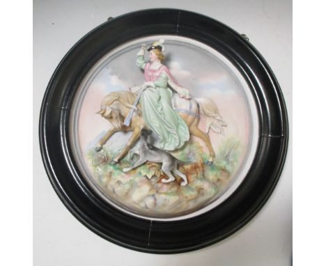 A pair of German bisque porcelain roundels with equestrian hunters in relief  