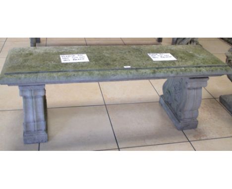 A reconstituted stone garden bench  