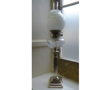 A Regency Style Corinthian Oil Lamp, the lamp having a cut-glass reservoir, approx 79 cms high.