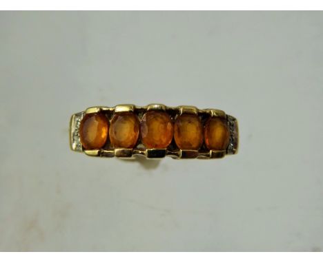 A Lady's 9ct Yellow Gold Channel Set Orange Sapphire and Diamond Ring, five sapphires approx 4.5 x 3.5 mm, approx 1.4 ct, siz