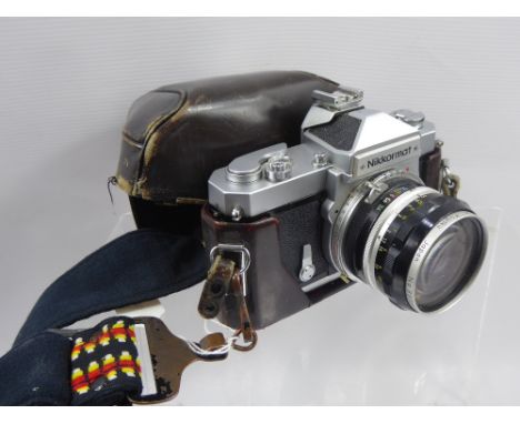 A Vintage 35 mm Nikkormat ft Camera, serial nr 3236725, with Nikkor-8 Auto 1:3.5 f = 2.8 cm lens and in original case and gua