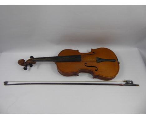 A German Pine Antonius Stradivarius Labelled Violin, label to interior together with bow.