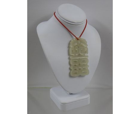 A Chinese White Jade Pendant.
