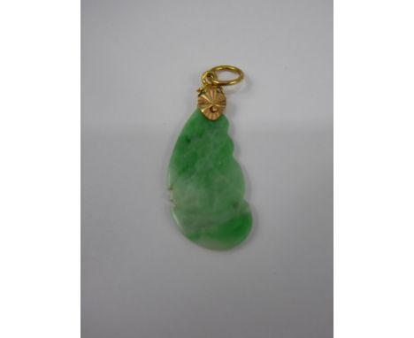 A Chinese Apple Green Jade Pendant, in the form of a bat, on a 14 ct gold loop, approx 2.7 cms, approx 1.5 gms