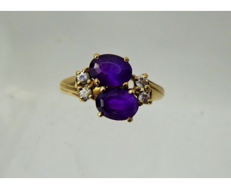 A Lady's Antique 9 ct Gold Amethyst and Diamond Ring, 2 x amethyst 7.5mm, 4 x 3.5 pts dias, size N, approx 2.9 gms