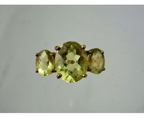 A Lady's Gems 9 ct Gold Citrine Ring, centre stone 12 x 10 mm, approx 3.18 ct, side stones 8 x 6 mm 1.68 ct, size R, approx 5