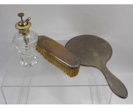 An Art Deco Silver Plate and Gold Enamel Atomiser, together with a solid silver hand mirror and clothes brush. (3)