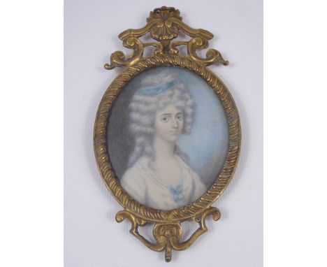 An 18th Century Portrait Miniature on Ivory, depicting a young woman, approx 8 x 6 cms
