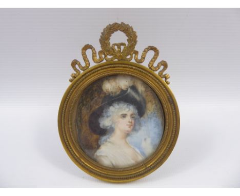 A 18th Century Portrait Miniature on Ivory, depicting a young woman, approx 6.5 x 6.5 cms