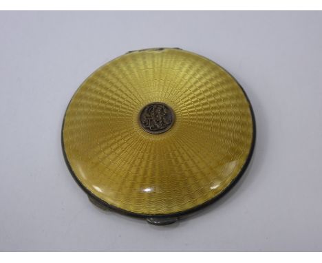 A Silver and Gold Guilloche Enamel Compact, London hallmark, dated 1930, mm CNC, approx 89 gms.
