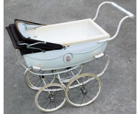 A vintage child's pram, with two size wheels, shaped handle and metal framework with articulated canopy, 58cm H.