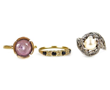 Three 9ct gold dress rings, comprising of a amethyst set dress ring, in four claw rub over setting, a blue and white stone ha