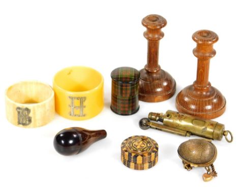 An early 20thC Cianranald Tartan thimble case, 4cm H, two small oak candlesticks, circular parquetry patch box  with screw to