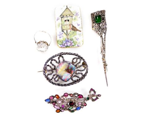 A small collection of brooches and effects, comprising of an oval silver plated brooch, with central opal style stone, a silv