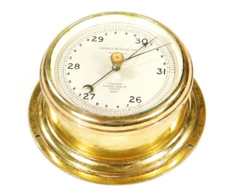 A 20thC Wheeler aneroid barometer, in circular brass case, with 10cm Dia. dial.