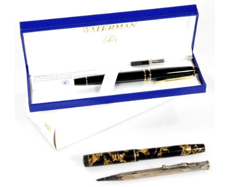 A cased Waterman's fountain pen, in black with gilt trim, a further Mentmore fountain pen in marble colours, 13cm W and a eng