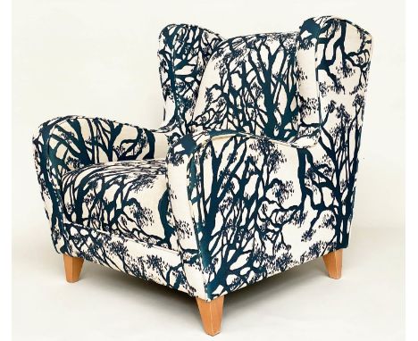 WINGBACK ARMCHAIR, blue and cream 'tree' print upholstery, with tapering beech supports, 77cm W. 